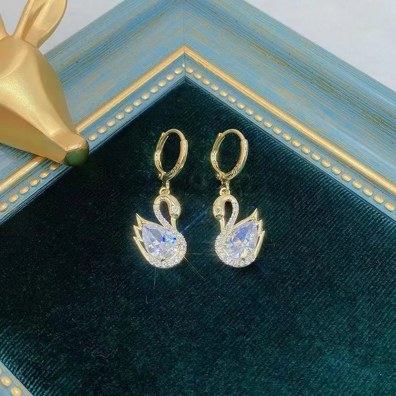 Boucles d'oreilles Cygnes blancs, bijou en alliage plaqué or 585 (14 ct) et en zircons naturels