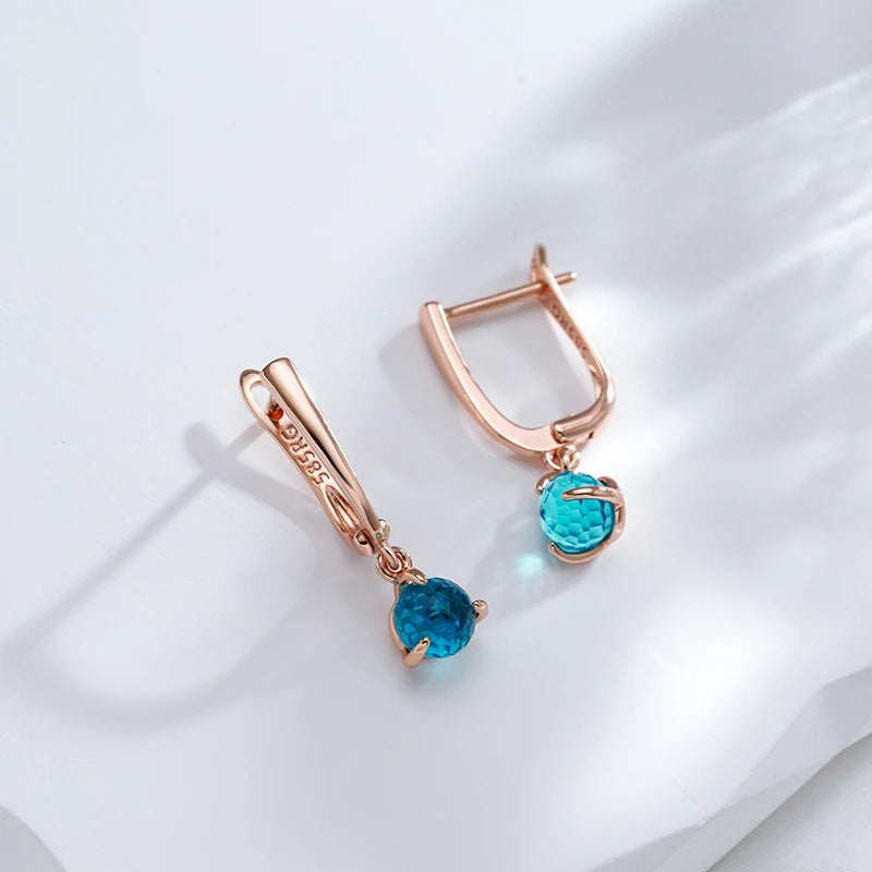 Boucles d'oreilles avec zircons ronds bleu clair, bijou en plaqué or rose