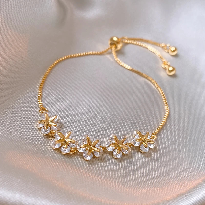 Bracelet Fleurs avec zircons blancs, bijou en alliage plaqué or rose et en zircons naturels