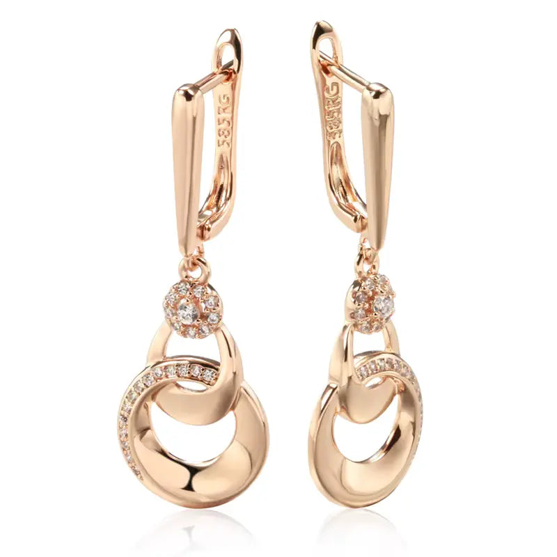 Boucles d'oreilles pendantes anneaux enlacés, bijou en plaqué or rose et en zircons naturels