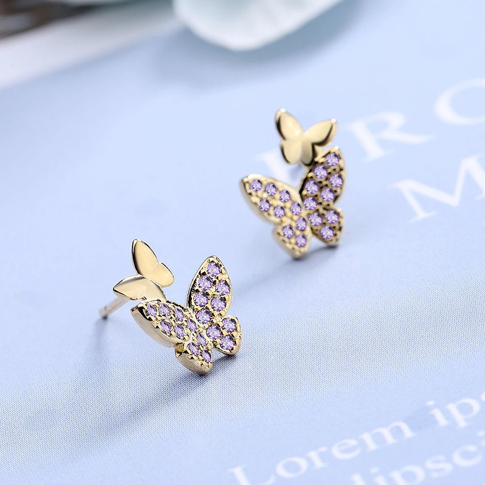 boucles d'oreilles papillons avec zircons mauves