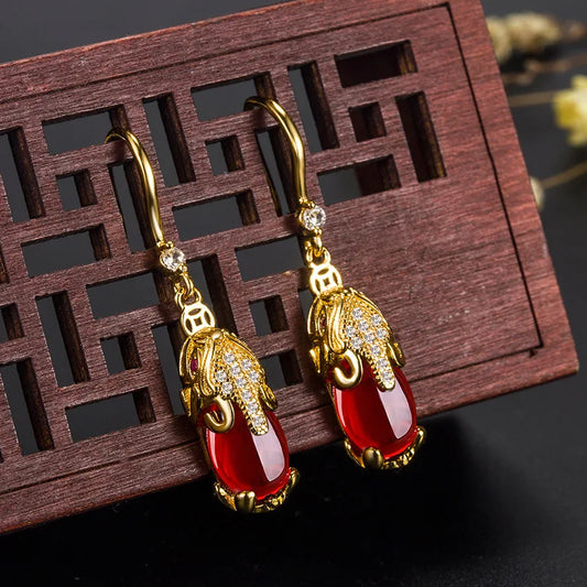 Boucles d'oreilles Eléphants avec pierre en agate rouge, bijou en acier inoxydable doré