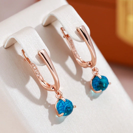 Boucles d'oreilles avec zircons ronds bleu clair, bijou en plaqué or rose