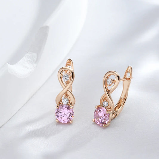 Boucles d'oreilles Symbole de l'infini et zircons roses, bijou en plaqué or rose