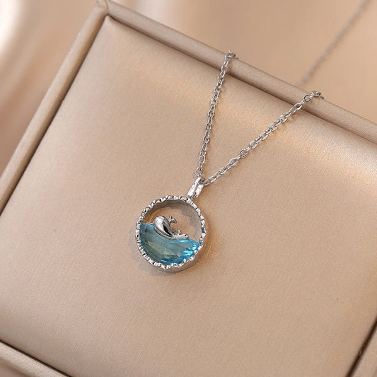 collier baleine avec cristal bleu