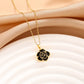 Collier Fleur noire, bijou en acier inoxydable doré et en émail