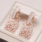boucles d'oreilles arabesques et zircons blancs