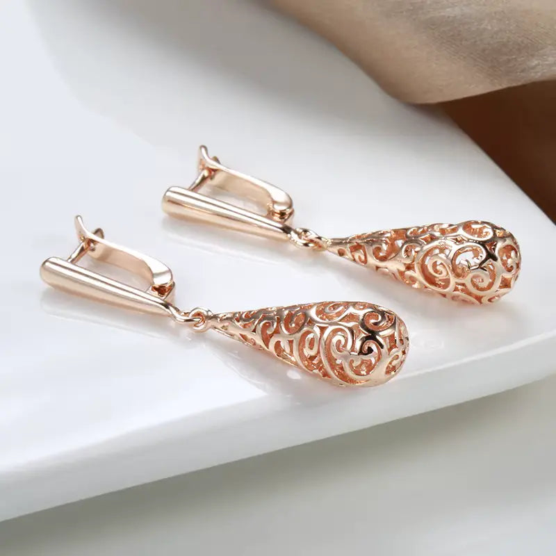 Boucles d'oreilles gouttes et arabesques ajourées, bijou en plaqué or rose 585 (14 carats)