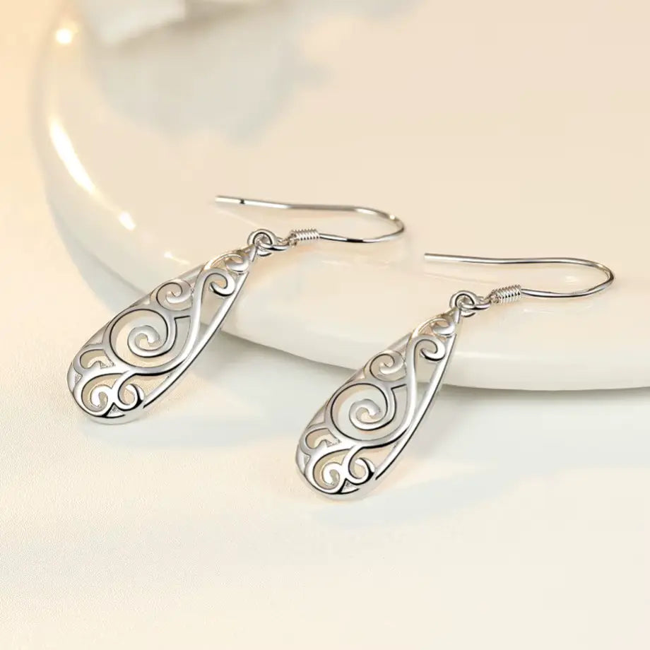Boucles d'oreilles arabesques ajourées, bijou en plaqué argent