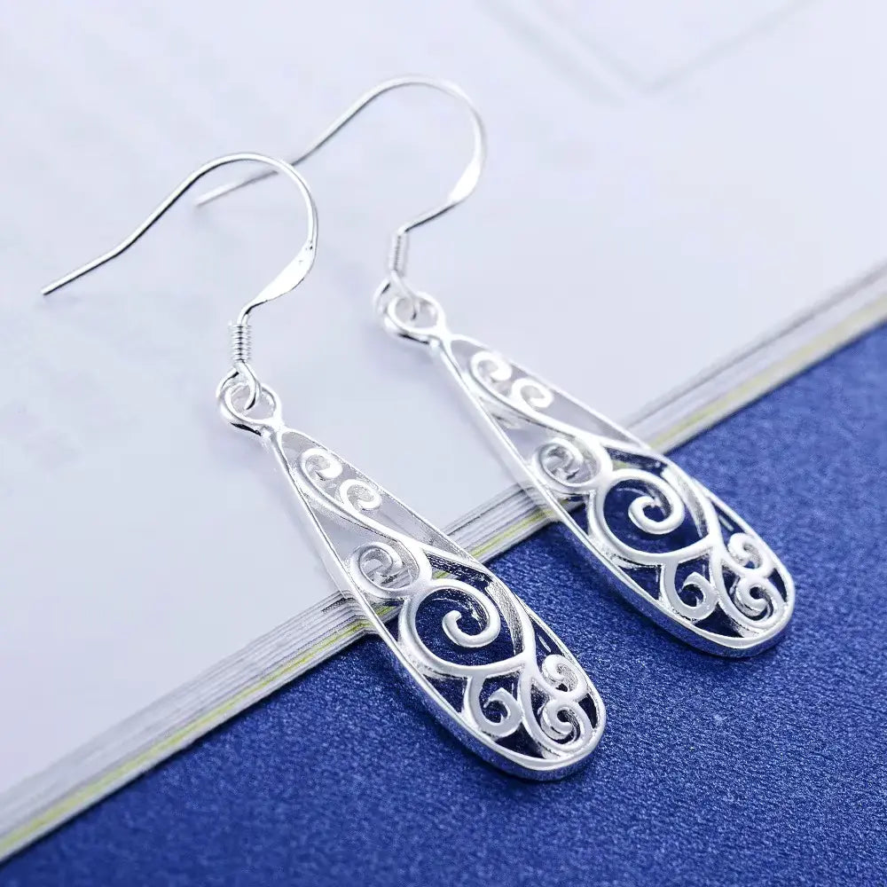 Boucles d'oreilles arabesques ajourées, bijou en plaqué argent