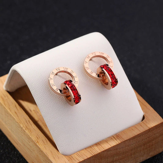 boucles d'oreilles en zircons rouges et avec chiffres romains