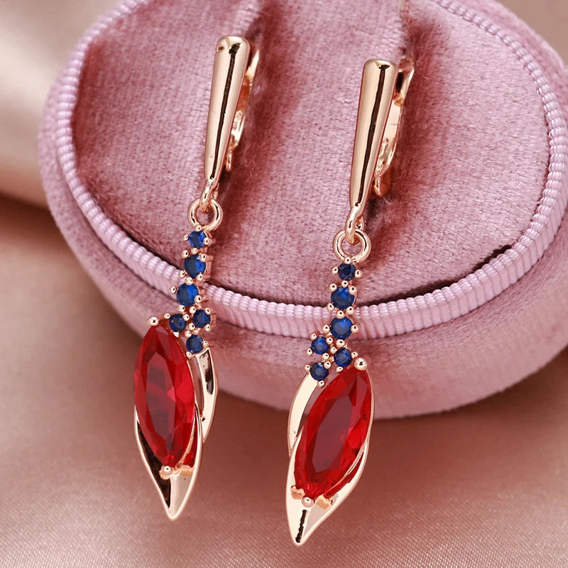 boucles d'oreilles serties de zircons rouges et bleus