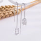 boucles d'oreilles pendantes chat et poisson