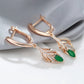 boucles d'oreilles avec zircons verts et blancs