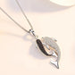 collier avec deux dauphins à zircons
