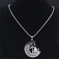 collier avec pendentif croissant de lune et mosquée